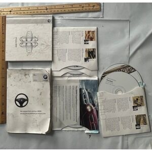 BMW Experience Performance DVD Set – "Uniquely BMW" / "The Debt" (Original OEM)